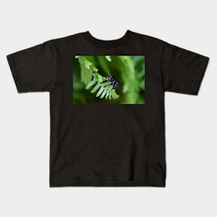 Nine-spotted moth on green leaf Kids T-Shirt